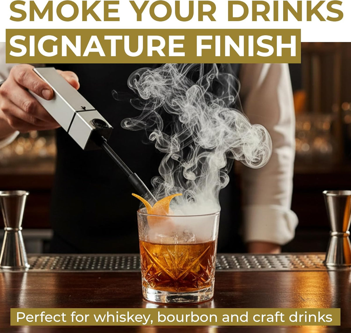 Cold smoke filling a whiskey glass from the handheld smoker's flexible hose