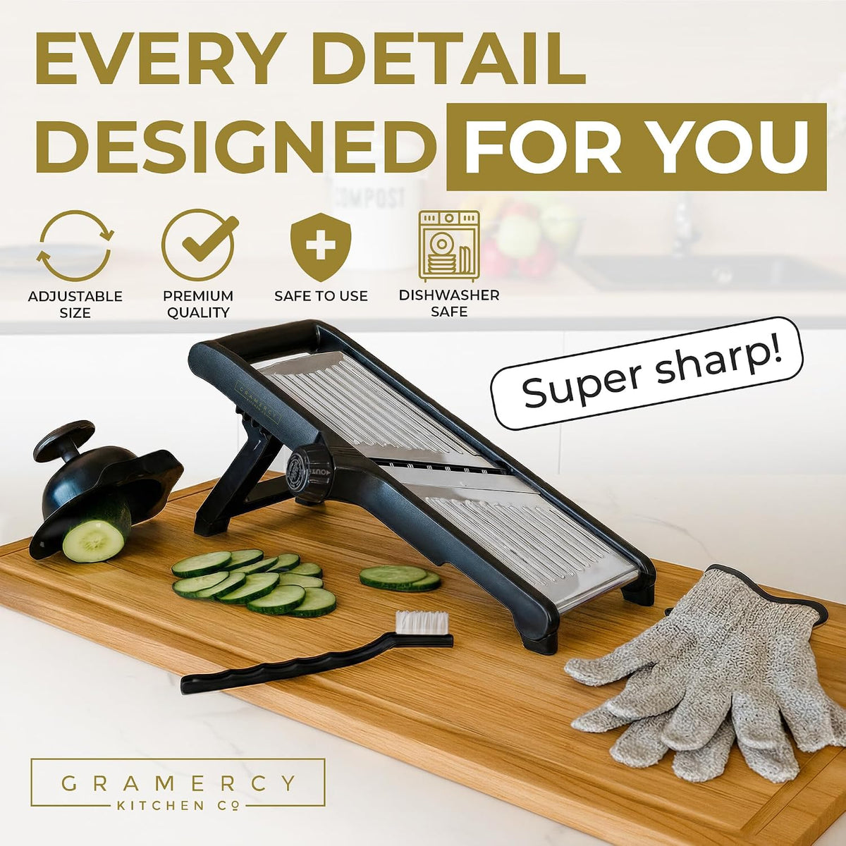 Black mandoline on a wooden board with sliced cucumber, cleaning brush and cut-resistant gloves