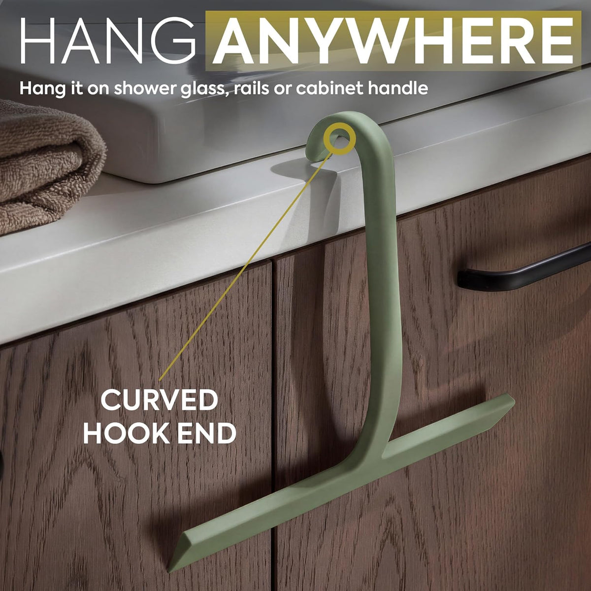 Angled silicone handle held in one hand while wiping a shower screen